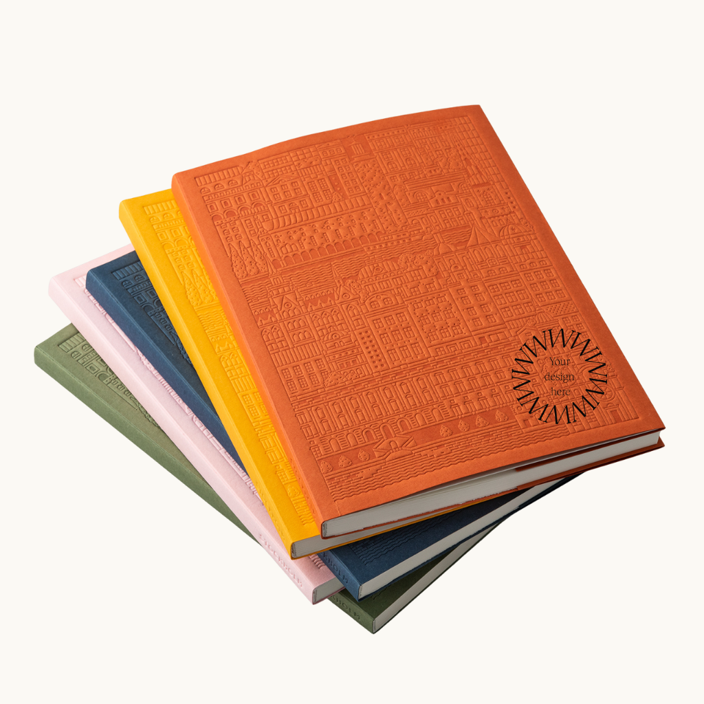 Stack of Stockholm notebooks in multiple colours. Sustainable branded notebooks from women-owned brands for corporate gifts.