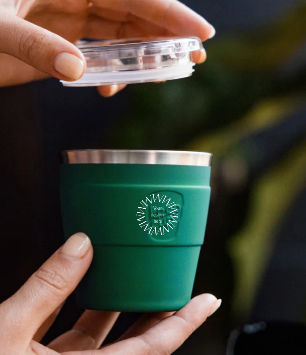 Thermal Travel Coffee Cup in green, showing logo placement