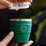 Thermal Travel Coffee Cup in green, showing logo placement