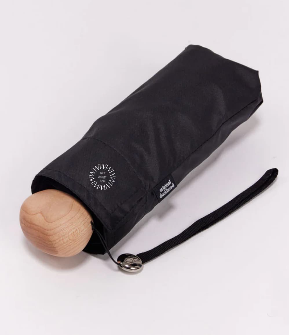 Ultra Compact Mini Umbrella in black, in its carry bag