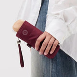 Ultra Compact Mini Umbrella in raspberry, held, closed