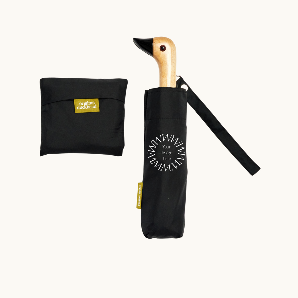 Folded black wind resistant umbrella personalised merchandise for events