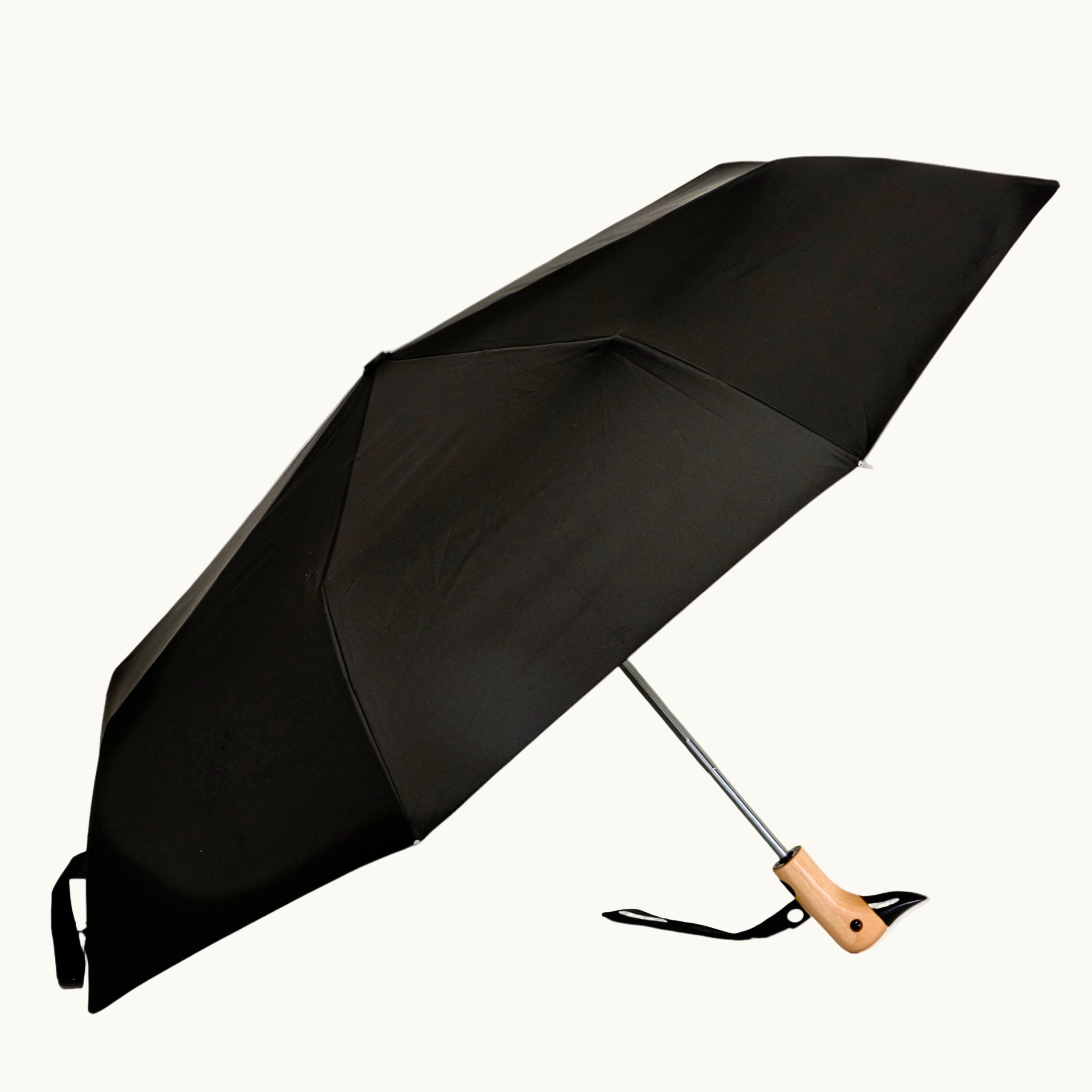 Compact black wind resistant umbrella for sustainable merch ideas 