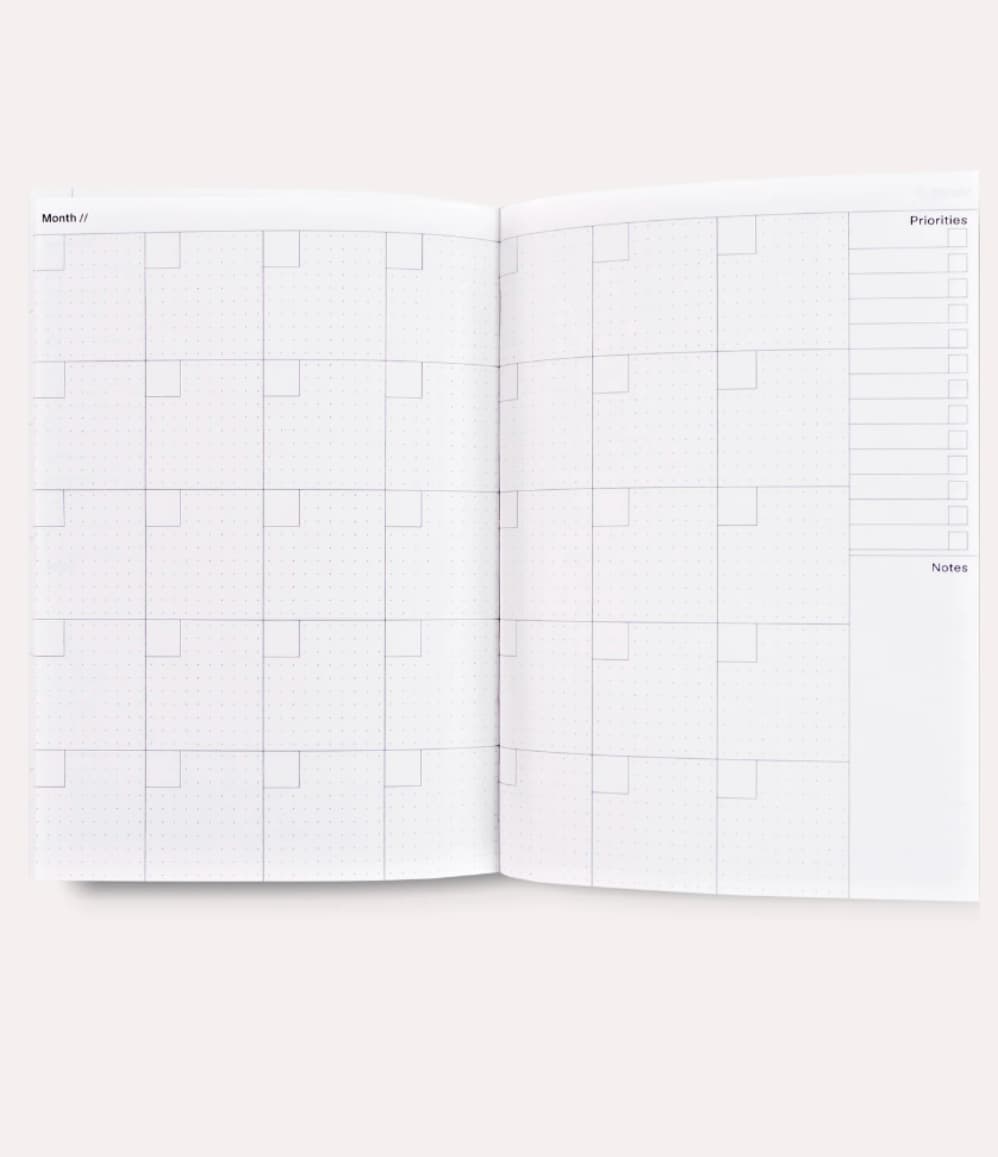 Undated Weekly Planner, open to the monthly priorities and notes layout