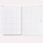 Undated Weekly Planner, open to the monthly priorities and notes layout