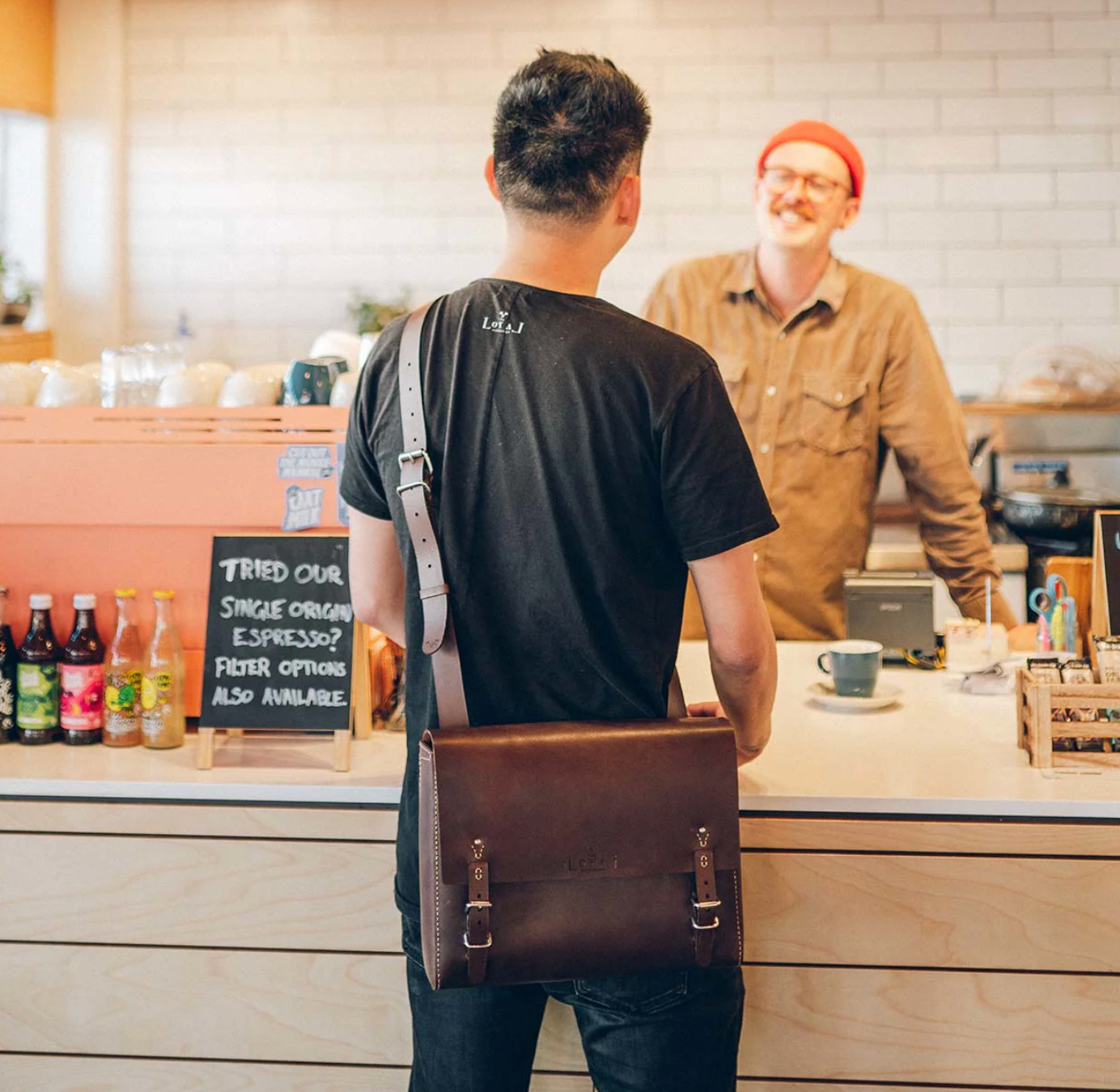 Hand-stitched vegan leather messenger bag for sustainable corporate gifting