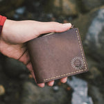 Vintage brown leather wallet hand stitched by women artisans India personalised corporate gift UK