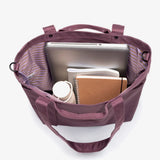 Interior of maroon water-resistant personalised conference bag showing the main compartment and inner pocket.