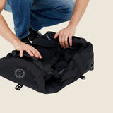 Wheeled Duffel 37L in black, folded and showing logo placement.