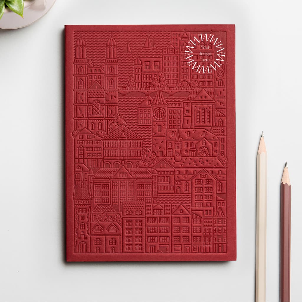 Red debossed Zurich notebook personalised for corporate gifting, premium sustainable event swag